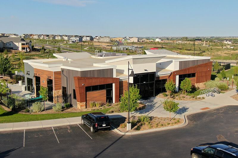 The Cove community center exterior at Barefoot Lakes